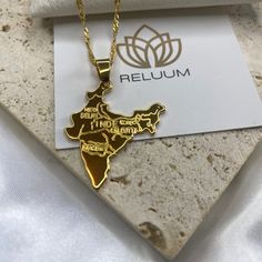 Elevate Your Style with ReluumJewellery's Country Map Pendant Necklaces: Introducing our India Map Outline Pendant Necklace, a symbol of admiration for the rich heritage and diverse landscapes of this vibrant nation. Crafted with meticulous detail, this pendant elegantly showcases the distinctive outline of India's map, capturing its cultural richness and historical significance. Whether you're a proud Indian or simply captivated by its allure, wear this piece with pride and grace.  🌍 Embrace t Traditional Gold Jewelry For Commemoration, Traditional Gold Necklaces For Mother's Day, Gold Jewelry For Celebration Or Gift, Gold Jewelry For Mother's Day Celebration, Traditional Gold Necklace For Mother's Day, Symbolic Gold Jewelry For Birthday Gift, Spiritual Yellow Gold Jewelry For Birthday Gift, Spiritual Yellow Gold Jewelry For Birthday, Spiritual Gold Name Necklace For Mother's Day