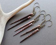 Sea Urchin Spike Earrings: Beautiful, bold, and totally versatile, these beautiful boho earrings are equally suited to a music festival, a stroll in the park, or a downtown cafe. They'll make you feel like the goddess you are! ✧ 3.75-4.25 inches long ✧ Comfortably lightweight at 1.5 grams each (less than a US dime) ✧ Ethically harvested sea urchin spines from the Philippines ✧ Choose between light or dark color ✧ Elegant aged brass ear wires ✧ Hypoallergenic hooks available on request ✧ Gift-re Spine Jewelry, Sea Urchin Spines, Witchy Earrings, Wiccan Jewelry, Seashell Earrings, Pagan Jewelry, Boulder Co, Spike Earrings, Festival Jewelry