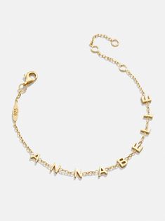 ​We took one of our favorite custom styles and shrunk it down for those seeking a more subtle accessory. The Mini 18K Gold Custom Spaced Letter Name Bracelet fits up to nine letters of your choice and features elegant negative space in between each character. It's also crafted with 18K gold plated sterling silver, so you'll get to wear it for years to come. Gold Sterling Silver Bracelet With Custom Name, Customizable Gold Name Bracelet In Sterling Silver, Customizable Gold Colored Sterling Silver Name Bracelet, Customizable Gold Sterling Silver Bracelets, Customizable Gold Sterling Silver Bracelet, Customizable 14k Gold Bracelet Jewelry, Customizable 14k Gold Bracelet, Classic 14k Gold Custom Name Bracelet, Dainty Yellow Gold Bracelet With Custom Name