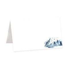 a white card with mountains in the background