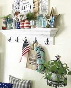 a shelf with some patriotic items on it and a potted plant in the corner