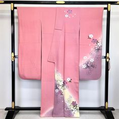 This is a furisode kimono. The elegant pink color is graded with cherry blossoms and peonies. Shoulder length: 162 Body length: 157 length from sleeve to sleeve: 66 Shoulder width: 32 Sleeve width: 34 Sleeve length: 108 Front width: 24 Back width: 30 Gore width:15.5 Sleeve length from the back to the end of the sleeve: 2.5 Sleeve length from the end of the sleeve: 2 Uchiaage: 7.5 Material: Pure Silk Condition:Please see photos. Thank you for visiting my page. My store owns a lot of unique items Cherry Blossom Kimono, Furisode Kimono, Clothing Design Sketches, Luxurious Wedding, Japanese Patterns, Gold Embroidery, Japanese Outfits, Button Flowers, Japanese Kimono