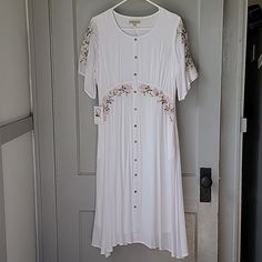 Brand New With Tags Beautiful White With Cream Colored Roses Embroidered Onto Flutter Sleeves And Bodice , Pockets Smoke Free Home Lined, Approx 46" Long Small Spot On Shoulder(See Last Pic) Buttons Are Non-Functioning Tags: Neesee's Dresses, Roolee, Piper And Scoot, Called To Surf , Modest , Church, Wedding, Shower White Fitted Rayon Dress, White Rayon Midi Dress For The Beach, Fitted White Rayon Dress, White Rayon Midi Dress For Vacation, White Rayon Maxi Dress, Flowy Rayon Dress With Floral Embroidery, White Flowy Rayon Maxi Dress, White Bohemian Rayon Dress, White Short Sleeve Maxi Dress With Floral Embroidery