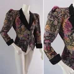 Vintage early 1980s fitted tapestry jacket. Lovely bold floral tapestry woven fabric. Beautifully fitted through the body Peplum waist. Huge puffed shoulders with pads narrow sleeves with moire silk cuffs. Size roughly 8-10 Measures Across shoulders-15in Across at waist -14in Pit-pit-17in Across at flared peplum--22in Nape-hem-22in Excellent condition Fitted Floral Print Blazer For Winter, Fitted Floral Print Blazer For Party, Fitted Floral Print Winter Blazer, Luxury Vintage Costume Outerwear, Fitted Silk Blazer With Floral Print, Vintage Long Sleeve Outerwear With Floral Embroidery, Fitted Vintage Blazer With Floral Print, Fitted Vintage Floral Print Blazer, Vintage Fitted Floral Print Blazer