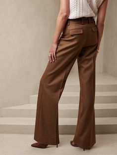 From boardroom to cocktail bar, this wide-leg trouser will have you feeling confident with an exquisitely tailored fit and a not-too-wide leg.  Crafted from a timeless all-season wool fabric from Italian mill Marzotto.  WIDE LEG FIT: High-waisted.  F Elegant Wool Dress Pants For Fall, Fall Wide Leg Pants With Welt Pockets, Elegant Pants With Welt Pockets For Fall, Fall Wide Leg Dress Pants With Pressed Crease, Elegant Fall Pants With Welt Pockets, Elegant Wool Pants For Fall, Tailored Wide-leg Dress Pants For Fall, Tailored Full Length Wide Leg Fall Pants, Chic Wool Pants With Welt Pockets