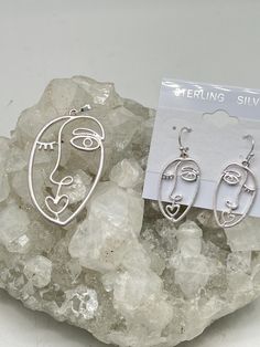 Abstract Face Pendant and Earring Set Pendant measures 2 1/8" long and 1 1/16" wide.   925 Sterling Silver Pendant Bail and Earwires  925 Sterling Silver Chain included  WWW.KARINSFORGOTTENTREASURES.COM Artsy Silver Metal Earrings, Artsy Sterling Silver Jewelry With Artistic Design, Artsy Silver Earrings With Ear Wire, Artsy Silver Pendant Jewelry, Artsy Silver Pierced Earrings, Artsy Nickel-free Silver Jewelry, Artsy Sterling Silver Drop Earrings, Artistic Silver Drop Earrings, Artsy Silver Earrings