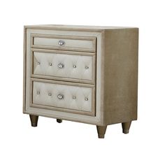 a white nightstand with three drawers and two knobs on the bottom, in front of a white background