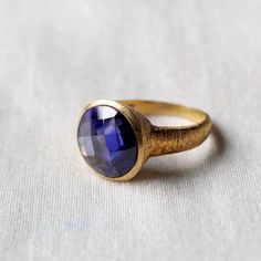 D E T A I L S - Stone: Tanzanite QuartzMaterial: 925 Sterling silverThe Fit: True to US ring size Finish: Textured and Gold Plated to a high shineS H I P P I N G & P R O D U C T I O N - My current production time is 2-6 business days, which means after those days are up, your order ships! I make everything custom to order, by hand, but I promise you it's worth the wait!R U S H - M Y - O R D E R -If you're in a rush to get your pretty new pieces, please send me a message and I'll let you know Gold Sapphire Rings With Faceted Detail, Elegant Hand Forged Sapphire Ring Gift, Hand Forged Round Sapphire Ring Gift, Elegant Hammered Dome Ring As Gift, Faceted Sapphire Round Ring, Handmade Round Sapphire Ring For Formal Occasions, Faceted Sapphire Rings, Elegant Hand Forged Sapphire Ring, Elegant Hand Forged Round Sapphire Ring