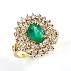 Emerald oval and diamond yellow gold ring Size 7.5 US - Ready to ship or Resize This is Emerald oval brilliant cut 0.97 carat gemstone measuring approximately 8.22x5.75x3.56mm flanked by a multitude of diamonds and set in 14k yellow gold ring. I provide a layaway payment plan just ask me. Ring Specifications: * 0.97 carat Emerald, oval cut * 54 Melee sized diamonds totalling 1.38 carats (31 x 1.5mm diamonds and 23 x 2mm diamonds). VS clarity, G-H color. * 14k yellow gold set ring * Ring size 7.5 Oval Yellow Gold Halo Ring Gia Certified, Yellow Gold Diamond Ring With Oval Cabochon, Luxury Oval Cluster Ring Stamped 14k, Luxury Stamped 14k Oval Cluster Ring, Gia Certified Oval Emerald Ring In Yellow Gold, Oval Emerald Ring In Yellow Gold With Halo Setting, Gia Certified Oval Diamond Ring In 14k Gold, Gold Oval Emerald Ring With Vvs Clarity, Elegant Oval Emerald Ring Stamped 14k