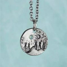 “Under A Blue Moon” Crescent Blue Topaz Gemstone/Crystal Silver Hammered/Textured Circular/Coin-Shaped Mountain Landscape Evergreen Forest Nature Scenic Hippie Bohemian Hiker Climber Skiier Snowboarder Necklace. Unisex. New. Measurements: Cable Chain Length: 18.5” (+2” Extender Chain) Pendant Diameter: 0.9” If You Want It, Don’t Let It Get Away Send Me An Offer! I Love To Do Bundle Order Discounts! Nature-inspired Silver Moon Jewelry, Silver Moon-shaped Nature-inspired Jewelry, Nature-inspired Silver Moon Shaped Jewelry, Nature-inspired Necklace With Moon Charm Round Pendant, Handmade Blue Moon-shaped Necklaces, Celestial Moon-shaped Natural Stone Necklace, Mountain Necklace Silver, Bohemian Moon-shaped Crystal Necklace Gift, Moon Crescent