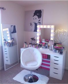 a white chair sitting in front of a desk with lots of makeup on top of it