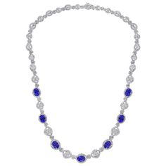 This extraordinary Necklace is consist of 7 Fine oval Tanzanite weighing approximately 11 Carats. There are total of approximately 13 carats of shimmering white diamonds, The clear, intense hue of this tanzanite is the most coveted of all these rare stones. In fact, deep blue tanzanites such as this one are worth more per carat than the more common light purple hues, Necklace is set in 18 Karat white gold. weight of 18 Karat gold is 27 Grams All our jewelry comes with a certificate appraisal and Luxury Oval Necklace With Prong Setting, Luxury Round Sapphire Diamond Necklace, Oval Sapphire Diamond Necklace, Oval Cubic Zirconia Necklaces For Formal Occasions, Classic Sapphire Diamond Necklace For Formal Occasions, Formal Round Sapphire Necklaces, Classic Sapphire Necklace For Formal Occasions, Formal Oval Diamond Cut Necklace, Formal Oval Diamond Cut Necklaces