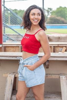 Celebrate the Fourth of July with our new USA Crop Top! This new arrival features a soft knit material, a square neckline, cami adjustable straps, and a cropped length. Pair this one with your favorite denim! Available in navy and red. cotton nylon hand wash with cold water lay flat to dry iron if needed Models are wearing a size small American Honey, Dad Wedding Gift, Mom Cards, The Fourth Of July, Dad Cards, Top Graphic Tees, Midi Maxi Dress, Outerwear Sweater, Top Sales