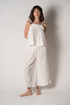 Not just for sleeping, this 100% organic gauze cotton lounge set is soft, lightweight and breathable. Perfect to wear on a summer day or evening! Wear to the beach or just relaxing at home. Made with adjustable shoulder ties and a drawstring waist for added comfort. Finished with contrast scalloped edges and a yoke sea Comfortable Cotton Sleepwear For Vacation, Summer Cotton Sleepwear With Elastic Waistband, Cotton Sleepwear For Summer Vacation, Summer Cotton Sleepwear For Beach, Chic Summer Cotton Sleepwear, Cotton Sleepwear With Elastic Waistband For Vacation, Summer Loungewear Sleepwear With Elastic Waistband, Summer Sleepwear With Elastic Waistband For Loungewear, Relaxed Summer Sleepwear For Lounging