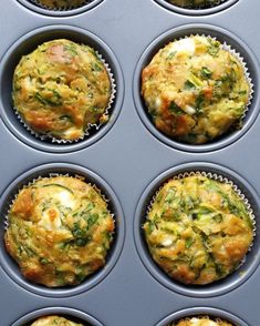 several muffins with different toppings sitting in a muffin tin