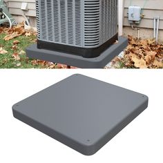 an air conditioner sitting in front of a house with leaves on the ground next to it