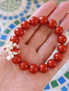 Handmade elastic bracelet with a cluster of natural white pearls and Mediterranean red coral sprigs and 12 mm imitation red coral paste pearls. width 18 cm adjustable Red Pearl Bracelets With Round Beads, Red Pearl Bracelet Gift, Red Pearl Bracelet As Gift, Red Pearl Bracelet As A Gift, Red Pearl Beaded Bracelets As Gift, Red Pearl Beaded Bracelet Perfect As A Gift, Hand-strung Red Pearl Beaded Bracelets As Gifts, Coral Red Coral Beaded Bracelets, Coral Red Beaded Bracelets As Gift