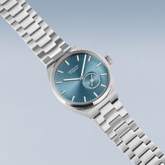 Crafted from stainless steel with link bracelets, the BERING ladies' watch embodies the brand's signature cool and minimalist style. Every detail of this design piece reflects the innovation and timeless design that BERING is known for. The iconic Arctic Blue sunray dial is adorned with luminous white and silver-colored indices and hands that ensure optimal legibility. A white tip on the second hand adds a touch of contrast and reflects the pristine beauty of the Arctic. The transparent case bac Silver Everyday Watch With Polished Finish, Modern Everyday Watches With Metal Dial, Modern Polished Finish Watches For Gift, Minimalist Silver Watch With Subdials, Modern Silver Watches With Polished Finish, Modern Silver Watches With Stainless Steel Clasp, Minimalist Stainless Steel Watch With Polished Finish, Modern Silver Watch For Everyday, Modern Silver Watch For Everyday Use