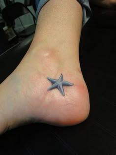 a person with a starfish tattoo on their foot