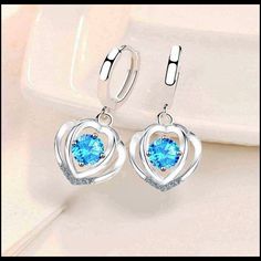 925 Sterling Silver Heart Shaped Blue Crystal Zirconia Earrings. Material: 925 Sterling Silver Stone: Zirconia Lead And Nickel Free Earring Style: Huggie Condition: Brand New Will Not Tarnish Or Fade Blue Heart Earrings For Gift, Blue Heart-cut Heart Earrings For Anniversary, Blue Elegant Heart Earrings For Pierced Ears, Elegant Blue Heart Earrings For Pierced Ears, Blue Heart Cut Earrings For Anniversary, Elegant Blue Heart Earrings For Anniversary, Blue Heart Drop Earrings, Blue Heart-shaped Earrings For Anniversary, Blue Heart Cut Earrings For Gift