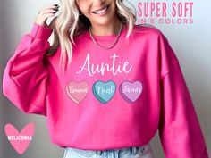 This cute, personalized Valentine's Day auntie sweatshirt is the perfect top to make your nieces and nephews feel seen and valued. <3 Our Bella+Canvas tees have that light and vintage feel. ♥ Our Comfort Colors tees and long sleeves are garment-dyed for that trendy distressed look. ♥ 》 》HOW TO ORDER 《 《 * Select product, size + color from the drop down menus * Add your custom teacher name, grade and school in. the personalization box.  * Add to cart + place order ♥ * Your shirt is now in production & will be ready to ship in 1-3 days! 》 》SIZING 《 《 All four products are unisex, men's cut tops. The Bella Canvas tees run longer than normal and slightly small - so I would NOT downsize. The Comfort Colors tees and long sleeves are boxy cut and true to size. The Gildan sweatshirts are true to s Cute Customizable Long Sleeve T-shirt, Customizable Cute Crew Neck Tops, Customizable Cute Long Sleeve Top, Cute Customizable Long Sleeve Top, Pink Long Sleeve Sweatshirt With Name Print, Personalized Pink Crew Neck Sweater, Casual Personalized Pink Tops, Custom Text Long Sleeve Tops For Gifts, Casual Personalized Pink Top