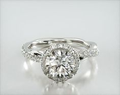 a white gold engagement ring with diamonds on it