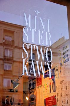 a store front window with the words'minn steer, stow kawy'written on it