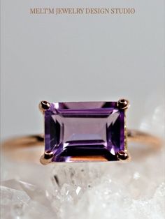 Emerald cut amethyst ring. This beautiful amethyst ring was made of 14k solid rose gold band and 8*6mm emerald cut amethyst stone in 14k rose gold prong setting   14k rose gold band is 1.3mm thickness .  This ring was handcrafted in our California Studio.  It's also available in 14k yellow gold or white gold.  #AmethystRing #EmeraldCutAmethyst #RoseGoldAmethystRing #GemstoneRing #PurpleRing 14k Gold Purple Emerald Cut Rings, Purple 14k Gold Ring With Emerald Cut, Purple 14k Gold Rings With Emerald Cut, Elegant Solitaire Amethyst Ring With Emerald Cut, Elegant 14k Gold Rectangular Amethyst Ring, Emerald Cut Amethyst Ring In Fine Jewelry Style, Emerald Cut Amethyst Ring, Fine Jewelry Style, Elegant Octagon Amethyst Promise Ring, Emerald Cut Amethyst Ring Fine Jewelry