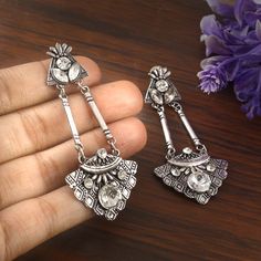 German silver designer earrings, a silver metal alloy which is known for its silver like appearance and excellent antique oxidized finish, It is ethnic designer earrings. This piece goes well with Indian outfits!! A piece to definitely win compliments!! Memorable gift for weddings and special occasions. Description  Item Code:- L3107 Antiquated Silver Plated Zircon Earrings  Measures-  A - 80x35mm approx B - 80x35mm approx C - 38x38mm approx D - 60x40mm approx Quantity- One Pair Note: This is crafted as a replica of silver and may have slight irregularities as it is crafted by hand.The product shipped will be same as shown in the picture however, actual colors may vary slightly from those shown due to the nature of photographing and monitor color settings. Please see more different designs Silver Alloy Earrings For Wedding, Silver Plug Earrings For Festive Occasions, Bohemian Alloy Earrings For Festivals, Silver Chandelier Earrings With Latkans For Gift, Silver Chandelier Earrings With Latkans As A Gift, Silver Festive Chandelier Earrings, Festive Silver Chandelier Earrings For Pierced Ears, Silver Nickel-free Danglers, Handmade Silver Alloy Earrings