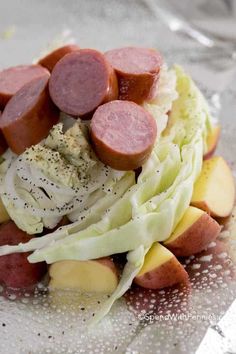 some sausages and lettuce on a plate