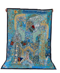 a blue and gold tapestry with an elephant on it's back, surrounded by other items