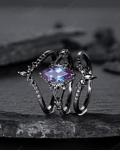 Rhodium black engagement ring like no other. This AMAZING piece of fine jewelry is the perfect expression of your eternal love. Its BLACK colors bring out the beauty of this ring. Alexandrite is the gemstone of luck, prosperity, and intellect. The alexandrite gemstone shines different colors in different lights. Under white light it shines more green and shines purple and blue under yellow light and daylight. More black gold rings ,please click here: https://www.etsy.com/shop/ShainGem?section_id Alexandrite Ring And Black, Gothic Party Ring Jewelry, Gothic Party Ring, Black Oval Gothic Jewelry, Gothic Black Oval Jewelry, Gothic Black Promise Jewelry, Gothic Promise Ring Jewelry, Gothic Open Ring Jewelry For Anniversary, Gothic Black Crystal Promise Ring