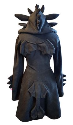 With this cute fleece hooded dress you can cosplay a black dragon! The dress is made with soft fleece and is super comfy! Perfect to wear at home, with friends or as a comfy cosplay to a convention! This dress is so cute :) The hood is lined with an extra layer of fleece to make it extra snuggly! The hood features cute 'ears' and spikes! The dress also has little wings and a cute tail. Please see the last image for the shape of the dragon tail. This dress is great to wear whenever you want, for Gothic Black Costume For Winter, Black Gothic Costume For Winter, Fitted Black Cosplay Costume For Fall, Black Halloween Cosplay Hoodie, Black Hoodie For Halloween Cosplay, Witchy Long Sleeve Costume For Cosplay, Black Long Sleeve Costume For Fall, Black Long Sleeve Fall Costume, Black Long Sleeve Cosplay Costume For Halloween