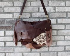 This bohemian bag is made of genuine  leather in dark brown. I use fringe details And you can pull out the fringe because they are attached with snap buttons.  The crochet is handmade. Large size. Closure is zipper. There are 1 zippered pocket inside and lined cotton fabric. Its  inner width is 37 and height is 27 cm. Thickness is 7 cm. (14.5'' x10.7'' x 2.8'' ) Strap is adjustable. Please note that color may vary according to monitor color calibrations. If you have any question, please don't he Brown Hobo Crochet Bag For Everyday, Brown Crochet Hobo Bag For Everyday Use, Artisan Handmade Brown Satchel, Bohemian Leather Shoulder Bag With Hand-stitched Details, Bohemian Crossbody Satchel With Fringe, Bohemian Soft Leather Crossbody Bag, Bohemian Fringe Crossbody Satchel, Bohemian Soft Leather Crossbody Satchel, Artisan Brown Satchel For Festival