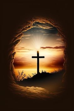 a cross is seen through a hole in the ground, with an orange sunset behind it