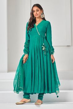 Parrot green soft chanderi angrakha anarkali with aari, pita and mukaish embroidered neckline. Comes with pant and a dupatta. Components: 3 Pattern: Embroidered Type Of Work: Aari, Pita, Mukaish Neckline: V Neck Sleeve Type: Full Fabric: Anarkali: Soft chanderi, Pant: Cotton stretch, Lining: Chanderi Color: Green Other Details:  Attached lining Length: Anarkali: 52 inches Sleeves: 23 inches Pant: 38 inches Dupatta: 2.5 mtrs Occasion: Mehendi and Haldi - Aza Fashions Angrakha Style Anarkali, Long Frocks For Women, Angrakha Anarkali, New Dress Pattern, Anarkali Designs, Green Anarkali, Long Frock Designs, Fashion Show Dresses