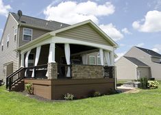 a house with a covered porch in the front yard