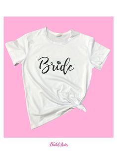 Dress it up or down! We are loving the "Bride" tee for all of our newly engaged and married BABES. Sizes are women's and runs small. Don't See Your Size? This Style will be Restocked in March! FINAL SALE. Bride Tee, Satin Gowns, Couple Tees, Purple Reign, We Are Love, Newly Engaged, Blush Roses, Stretch Satin, Bride Bridal