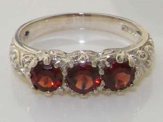 Luxury Solid 9K White Gold Natural Garnet Art Nouveau Carved Trilogy Band Anniversary Ring - Made in Formal Garnet Three-stone Rings, Three Stone Garnet Jewelry For Anniversary, Formal Three Stone Garnet Rings, Formal Three-stone Garnet Rings, Formal Three Stone Garnet Jewelry, Hallmarked Round Garnet Ring, Garnet Three-stone Wedding Jewelry, Three Stone Ruby Ring For Anniversary, Formal Three Stone Ruby Ring