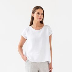 "Loose fit linen blouse TAHOE in white color is here to become your most loved piece for warm-weather outfits. Oversized, short sleeves, asymmetric hemline - our linen top has everything you need to feel chill & stylish. Perfectly suitable for summer escapes but equally works for an office look. Please note that actual colors may vary due to the many variations in monitors and browsers. DETAILS * Oversized silhouette * Short sleeves * Asymmetric hemline * True to size * Model is wearing size S a Linen Tshirt, Wrinkled Clothes, Weather Outfits, Linen Tshirts, Warm Weather Outfits, Linen Blouse, Oversized Top, Oversized Silhouette, Clothing Care