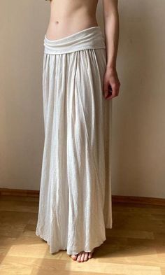 This long beige bohemian style skirt is perfect for the summer days and nights. Condition: great vintage condition Model is 169 cm/5.6" tall and wears S,M Flat measurements: waist: 35 cm/ 14'', there is elastic band on the waist total length : 100 cm/ 39" Material: linen and cotton Size : US 8/ EU 40 Our second hand garments are carefully picked from various locations. Each piece can make a unique and sustainable addition to your wardrobe. Some of the items might have slight imperfections which Waist-length Skirt For Beach In Spring, Beach Wide Leg Skirt With Elastic Waistband, Full-length Beige Bottoms For Beach, Cream Lined Skirt For Summer, Chic Full-length Maxi Skirt For Beach, Beige Full-length Beach Bottoms, White Maxi Length Summer Bottoms, Beach Maxi Skirt With Elastic Waistband, Beige Full-length Bottoms For The Beach