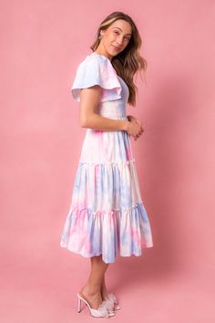 This magical dress is packed with the most whimsical details --- a flowy skirt, super soft 100% cotton, smocked bodice, and a subtle square neck-line that doesn't sacrifice coverage. Perfect for gender reveals, parties and just because. Cute Tiered Dress With Smocked Back, Summer Cotton Smocked Dress With Flutter Sleeves, Spring Dresses With Smocked Bodice And Ruffle Sleeves, Flowy Smocked Dress With Flutter Sleeves For Garden Party, Cotton Smocked Dress With Flutter Sleeves And Ruffles, Pink Dresses With Smocked Bodice And Tiered Skirt, Flowy Smock Dress With Square Neck, Flutter Sleeve Dress With Smocked Bodice For Garden Party, Feminine Cotton Dress With Smocked Bodice