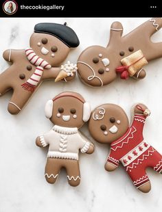 three decorated gingerbread cookies sitting on top of a counter