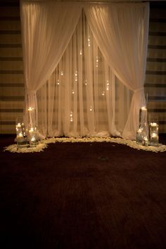 an image of a room with lights on the floor and curtains in front of it