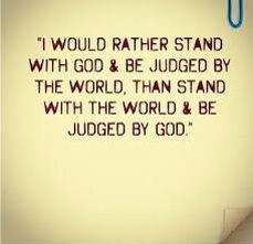 a bathroom with a toilet and a quote on the wall that says, i would rather stand with god & be judged by the world than stand with the world & be judged by god