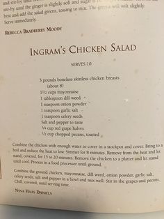 an open book with instructions on how to cook chicken salad in english and spanish, sitting on a table