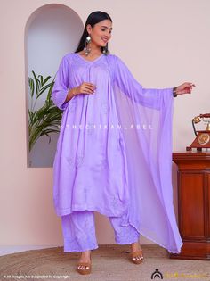 "Lavender Alia Muslin Chikankari Kurta Set with Dupatta Lucknow Chikan Handmade Dress for Women Kurti Fabric: Muslin Cotton Sleeves: 3/4 Sleeves Style: A-Line Kurti Kurti Length: 42-44 Inches Pant Length: 36-38 Inches Occasions: Casual Wear, Office Wear, Festive Wear Garment Care: Hand Wash Only Net Content: 1x Kurti 1x Palazzo with Dupatta <> \"Crafting Culture\" as our Tagline says by the nature of how our designs are made, we are striding delicately and leisurely on the planet, as everything from our pattern cutting to block-printing to embroidery and washing is done by human hand in small batches. The small-scale, handmade production allows for centuries-old techniques to be viable and sustainable for our artisans, as we are not demanding they make 1000+ units in a short-lead time. A s Purple Chikankari Embroidery Sets For Festive Occasions, Purple Chikankari Embroidery Festive Sets, Festive Purple Chikankari Embroidery Sets, Festive Purple Chikankari Sets, Traditional Lavender Chikankari Embroidery Sets, Lavender Semi-stitched Traditional Wear For Eid, Festive Lavender Chikankari Embroidery Set, Traditional Lavender Semi-stitched Sharara, Unstitched Traditional Lavender Kurta