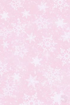 a pink background with white snowflakes on it