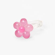 Add this cute and dainty ring to your jewelry collection! Perfect to add a pop of color, this clear resin style ring features a pretty pink flower complete with sparkly glitter. Sizes Available: 7, 8 Finish: Clear Material: Plastic - Claire's Clear Glitter Flower Resin Ring - Pink Pink Flower Promise Ring, Spring Pink Flower Ring Gift, Pink Flower-shaped Promise Ring, Adjustable Pink Flower Shaped Rings, Adjustable Flower Ring For Party, Trendy Flower Shaped Ring For Gift, Pink Ring For Spring Gift, Pink Ring As Spring Season Gift, Pink Rings Suitable For Spring Gift