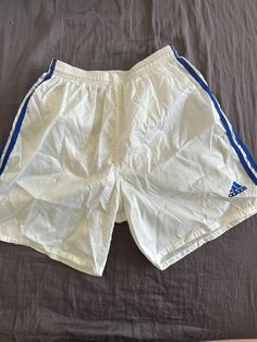 Vintage nylon shorts White Nylon Shorts For Streetwear, White Moisture-wicking Nylon Shorts, Sporty White Shorts For Outdoor, White Sportswear Shorts For Outdoor, White Short Bottoms For Outdoor, White Nylon Sports Bottoms, White Nylon Athletic Shorts, White Nylon Athletic Shorts For Streetwear, White Nylon Outdoor Bottoms